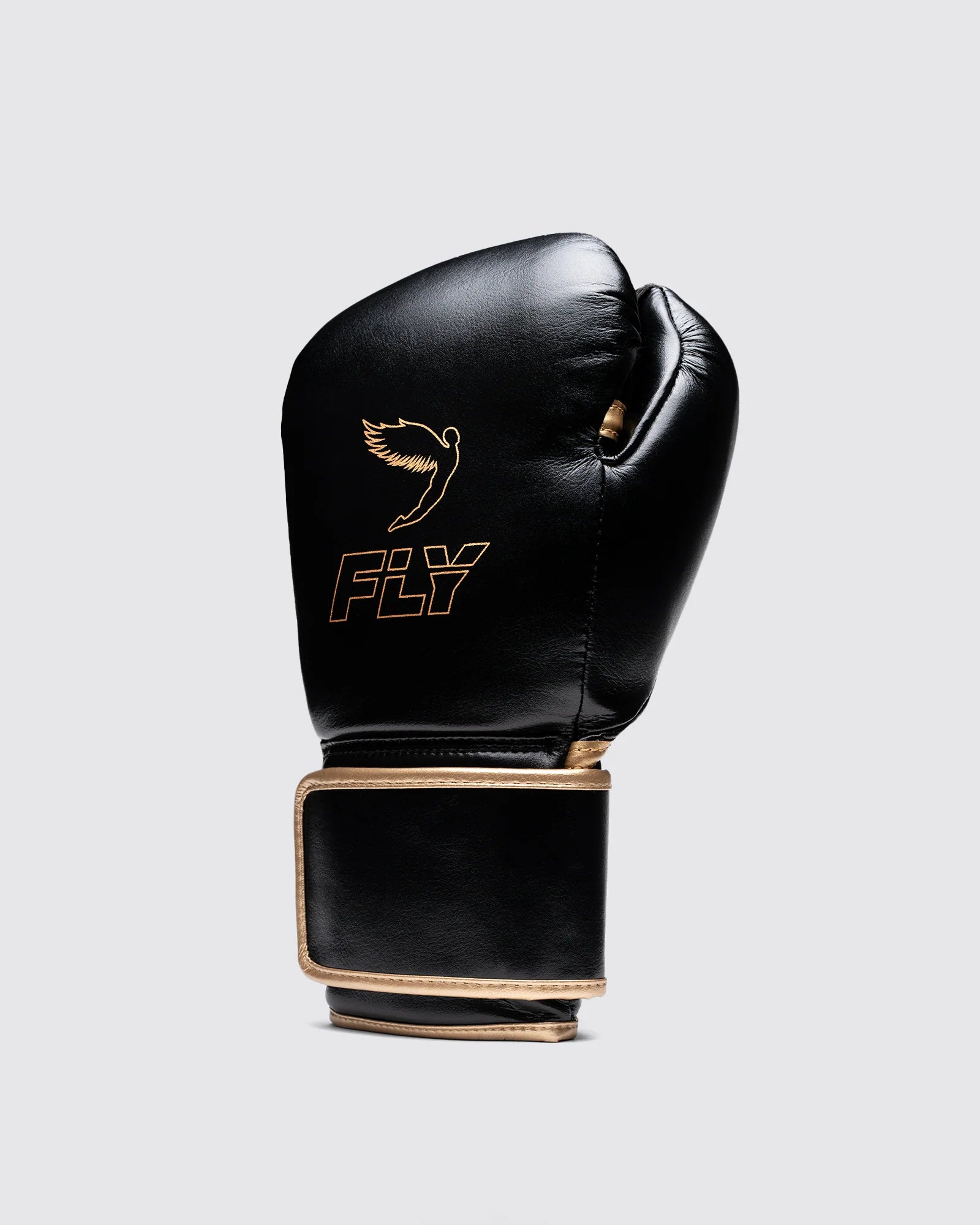 Side profile of Fly Superloop Pro X2 black and gold gloves highlighting raised cuff and ergonomic fit.