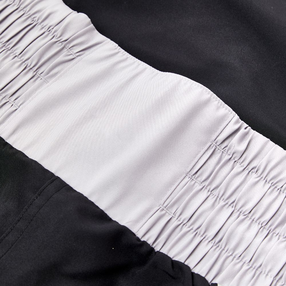 close up of elastic waistband on black Nike boxing shorts