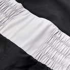 close up of elastic waistband on black Nike boxing shorts