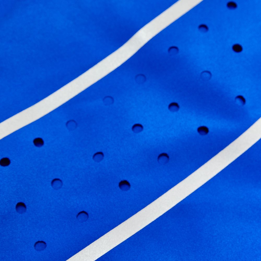 side view of blue boxing shorts showing movement-friendly cut