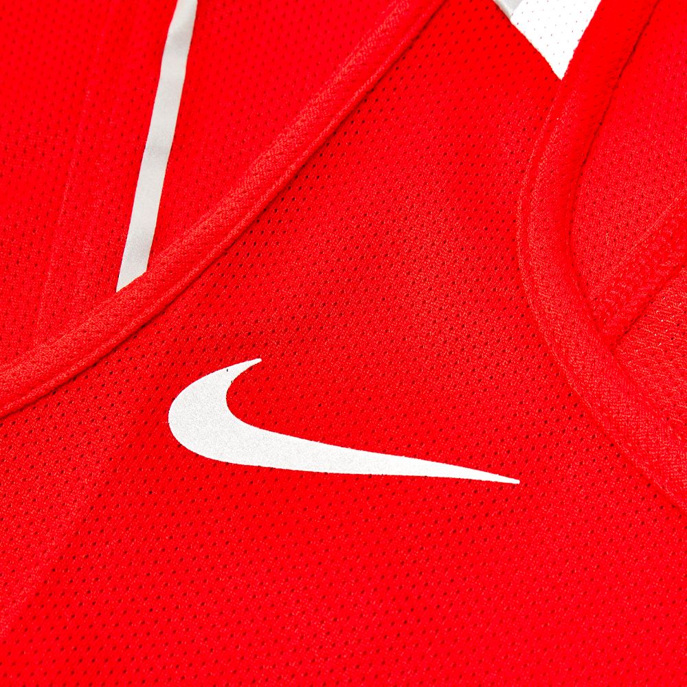 close up of breathable mesh fabric on red boxing vest