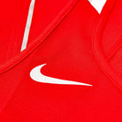 close up of breathable mesh fabric on red boxing vest
