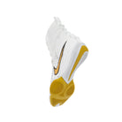 Boxer wearing White/Gold Nike HyperKO 3 boxing shoes while practising footwork drills in a boxing gym.
