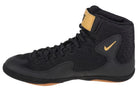 Wrestler training in Nike Inflict Black/Gold wrestling boots showcasing grip and flexibility.