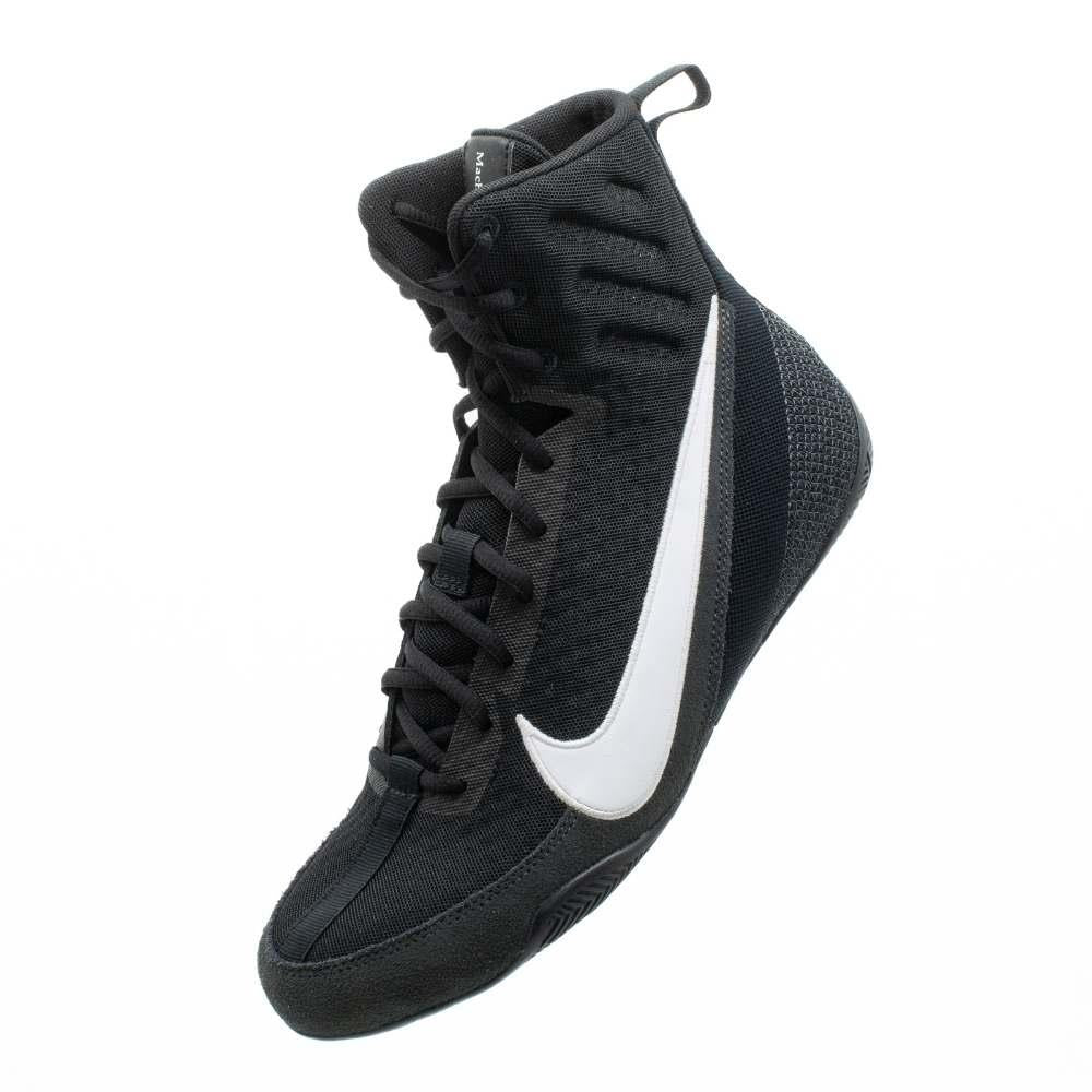 Boxer wearing Nike Machomai 3 Black and White boxing shoes during ring training session.
