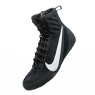 Boxer wearing Nike Machomai 3 Black and White boxing shoes during ring training session.