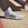 Product video of Adidas men’s wrestling shoes showing flexibility, breathability, and anti-slip mat grip during wrestling performance.