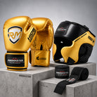 Young boxer wearing RingMaster Sports Kids Boxing Set with Gold boxing gloves and Black Gold head guard during boxing training