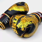Side profile of Twins BGVL4 Dragon boxing gloves showing streamlined shape