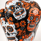 side view of Twins Calaveras orange gloves showing skull design and cuff