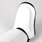 Rear view of White Twins Double Padded Leather Shin Guards showing the adjustable hook-and-loop strap area