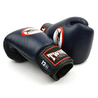 Side profile of Twins Special BGVL4 Navy Boxing Gloves showing ergonomic shape and tight-fit hand compartment.