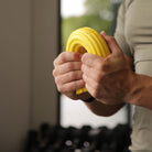 Person using Twist & Flex Resistance Bar at home for wrist and elbow rehabilitation.