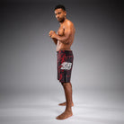 Side view of Venum 20th Anniversary Fightshorts Black Red showing fight shorts profile