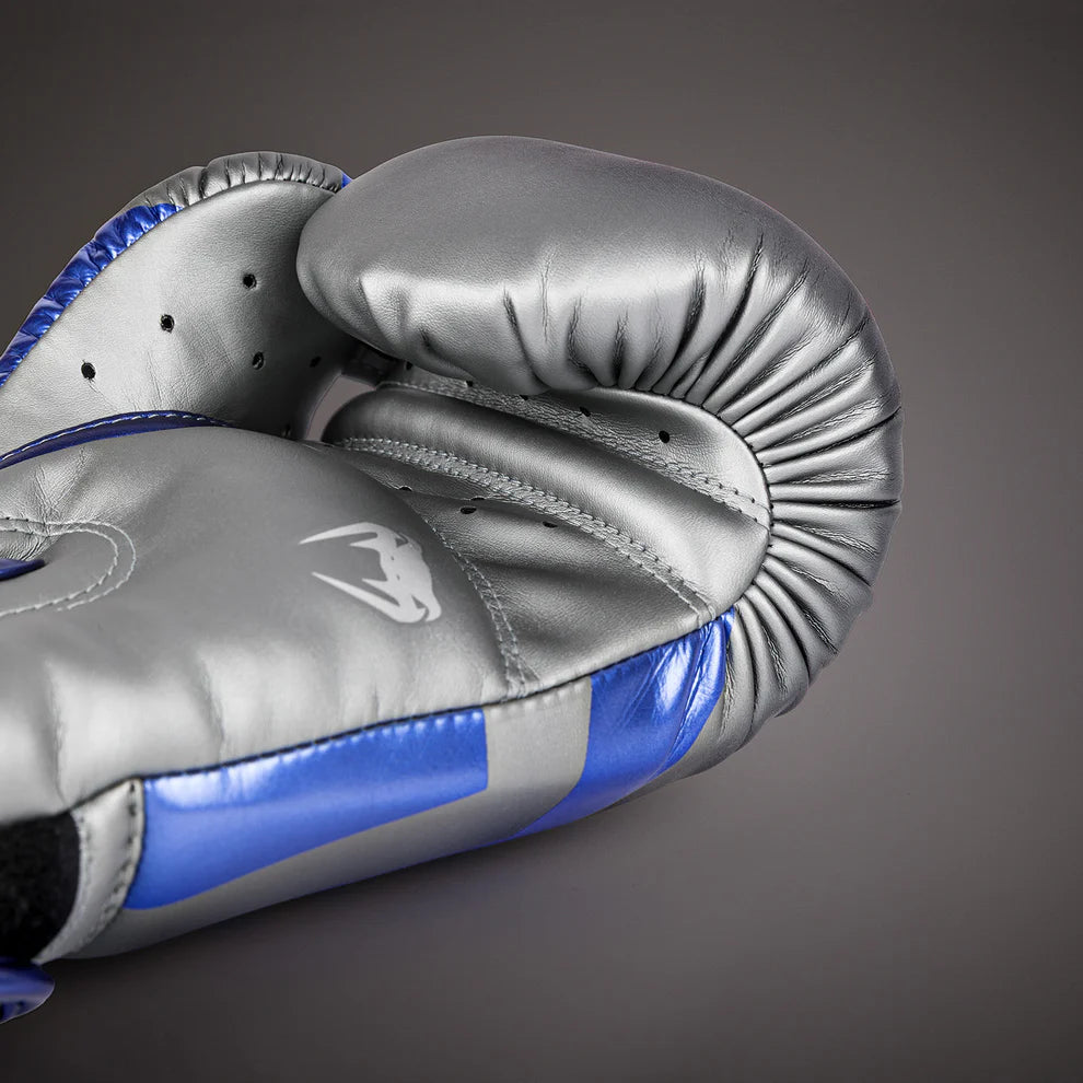 Venum Elite gloves with triple-density foam padding for maximum shock absorption.