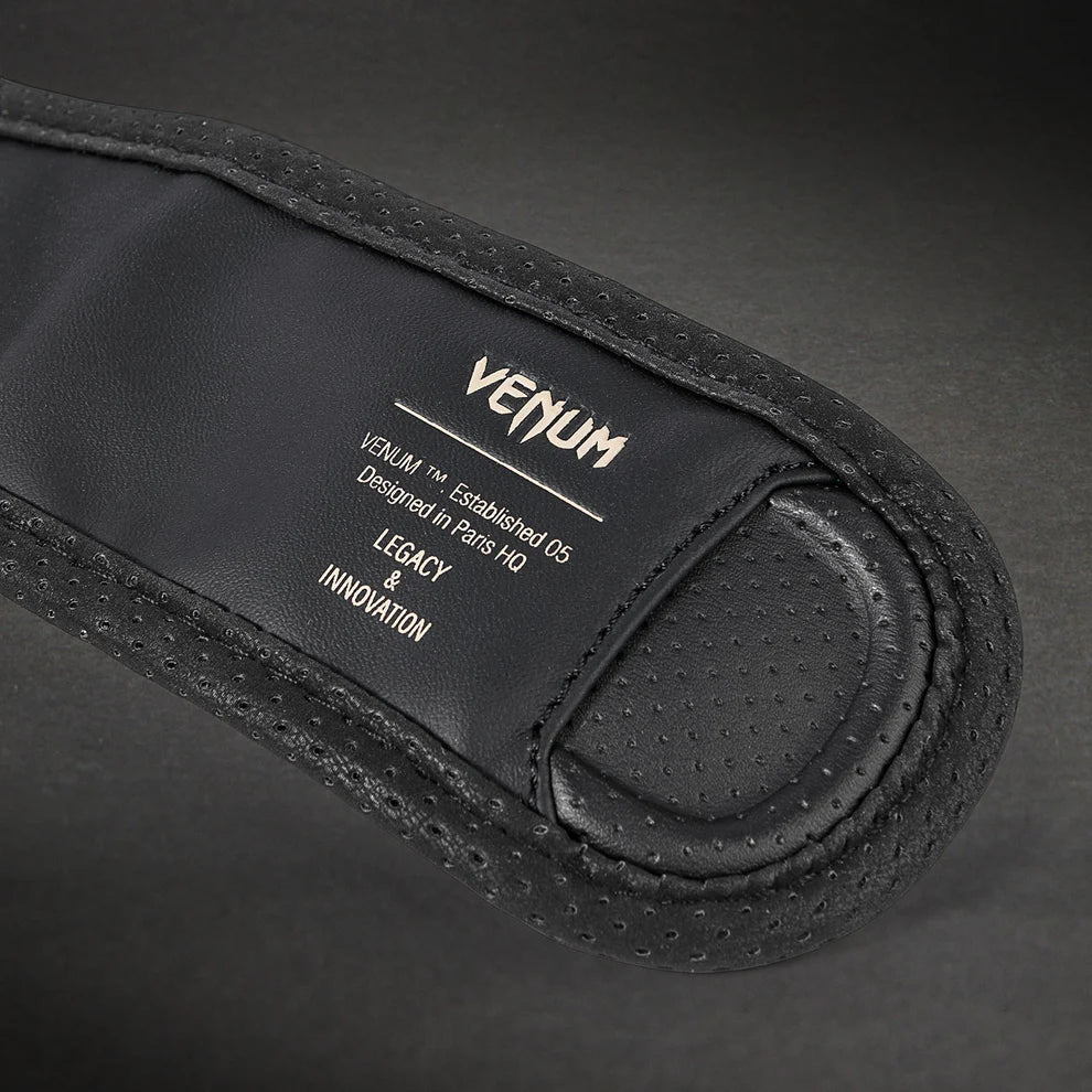 Pair of Venum Impact Evo MMA Sparring Gloves Black shown together with Venum logos visible