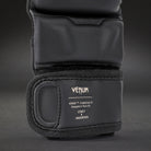 Wide hook and loop wrist closure close-up on Venum Impact Evo MMA Sparring Gloves Black