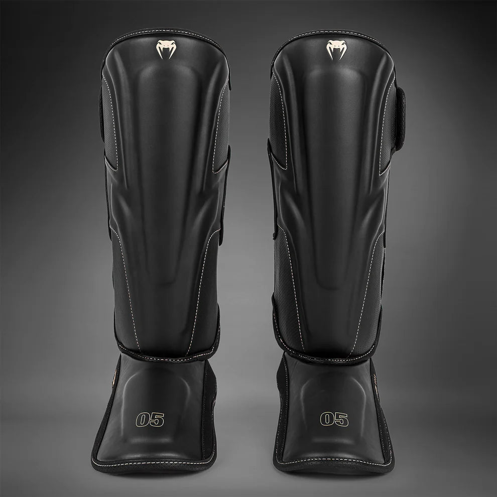 Venum Impact Evo shin guards black front view product