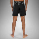 Back view of Venum Light 5.0 Fightshort Black White with Venum logo on the waist