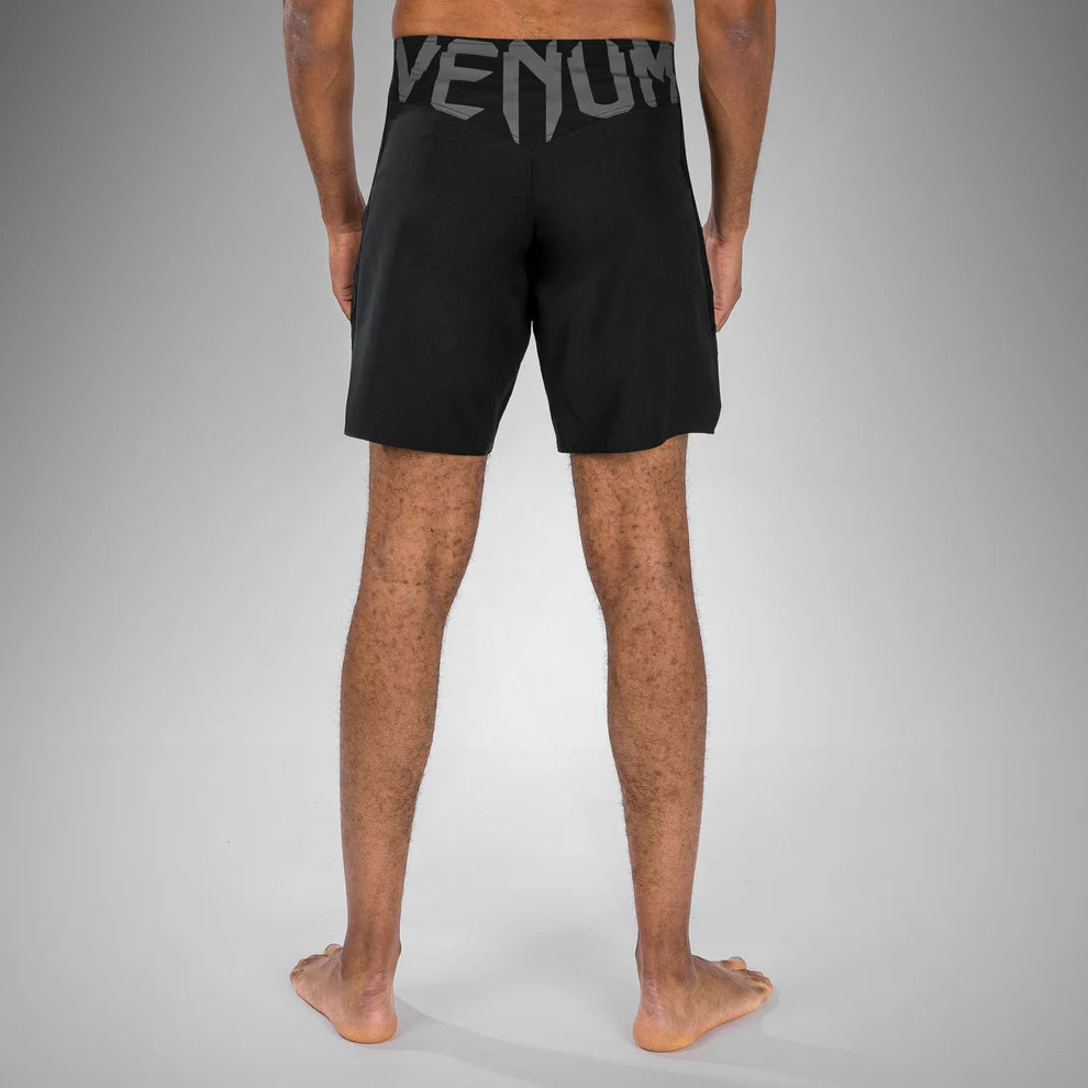 Back view of Venum Light 5.0 Fightshort Black White with Venum logo on the waist