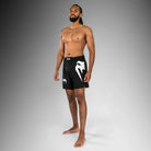Side view of Venum Light 5.0 Fightshort Black White showing reinforced side slit for mobility