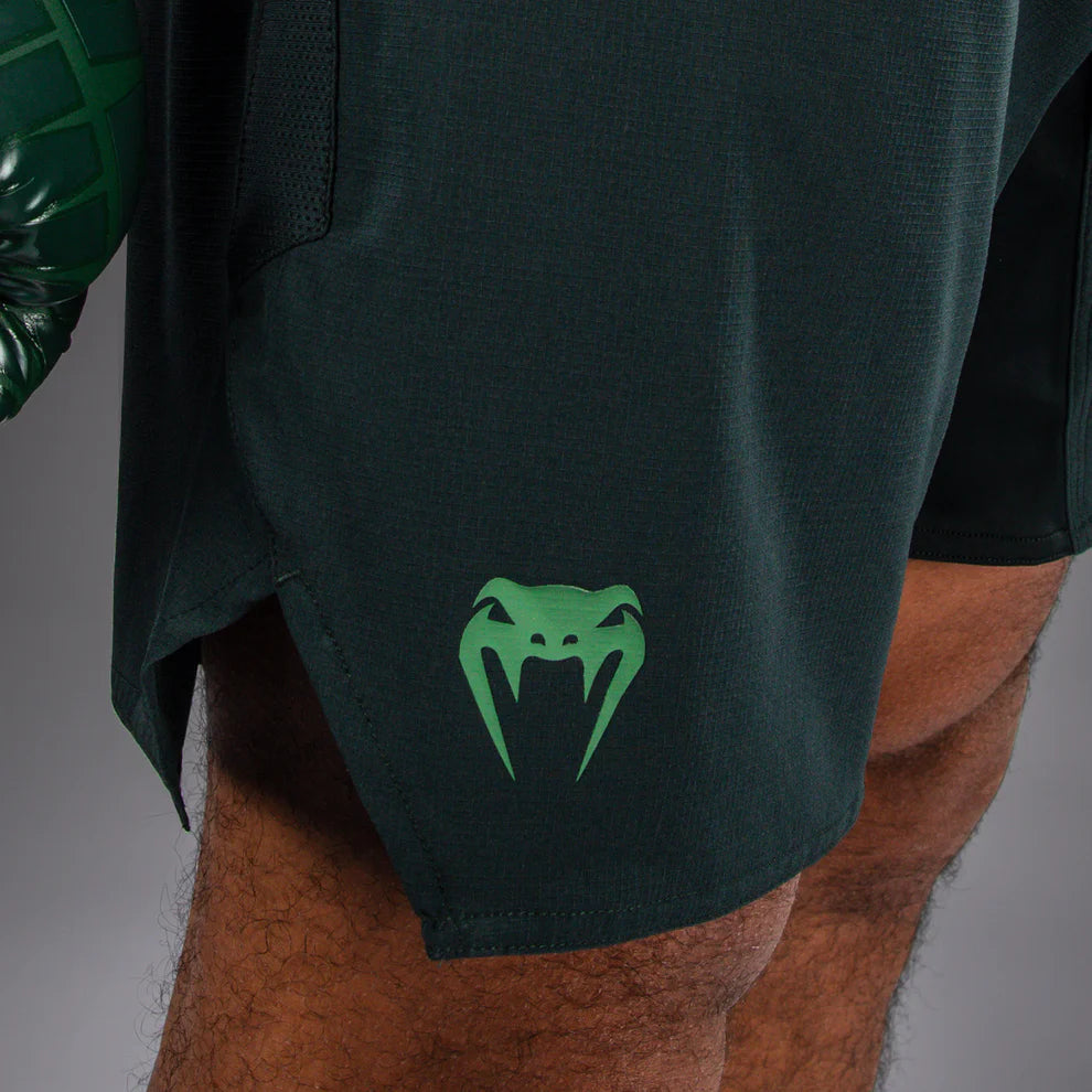 Side view of Venum Light 5.0 Fightshort Forest Green Light Green showing reinforced side slit for mobility