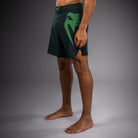 Venum snakehead logo detail on thigh and outer leg of Venum Light 5.0 Fightshort Forest Green Light Green