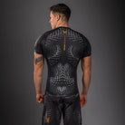 Back view of Venum Matupa Short Sleeve Rashguard Black Grey Gold for BJJ and MMA training