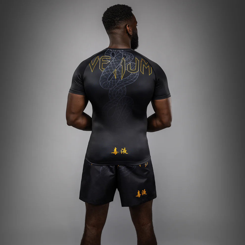 Back view of Venum Serpenti Short Sleeve Rashguard Black Silver Gold for BJJ and grappling training