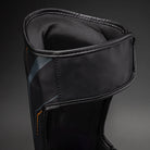 Black/Gold Venum Streamline Shin Guards showing the rear fastening area and adjustable support straps