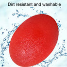 Silicone hand grip ball being rinsed under water for cleaning