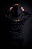 Model wearing the Zander Premium Cotton Training Hoodie in a casual athletic setting